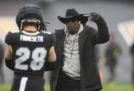 Colorado head coach Deion Sanders directs safety Ben Finneseth during the first half of the team's spring NCAA college football game Saturday, April 27, 2024, in Boulder, Colo. (AP Photo/David Zalubowski)