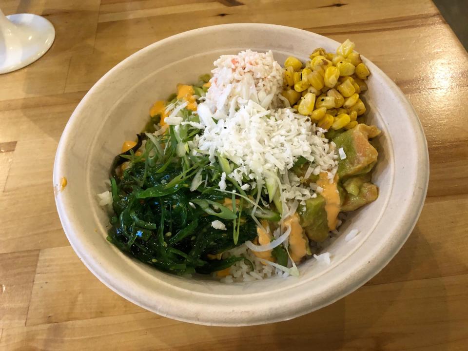 A Sakura Salmon bowl at Poke Papa, which includes Atlantic salmon, scallions, and a yuzu jalapeno cilantro sauce.