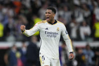 Real Madrid's Jude Bellingham celebrates after scoring his side's third goal during the Spanish La Liga soccer match between Real Madrid and Barcelona at the Santiago Bernabeu stadium in Madrid, Spain, Sunday, April 21, 2024. (AP Photo/Manu Fernandez)