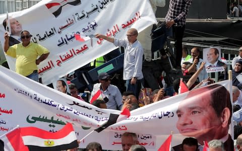 Supporters of President Abdel Fattah al-Sisi during a rally in Cairo - Credit: KHALED ELFIQI/EPA-EFE/REX&nbsp;