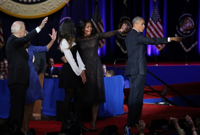 President Barack Obama (R), First Lady Michelle Obama (2L), daughter Malia Obama (C), Vice President Joe Biden (2L), and Jill Biden wave to supporters in Chicago