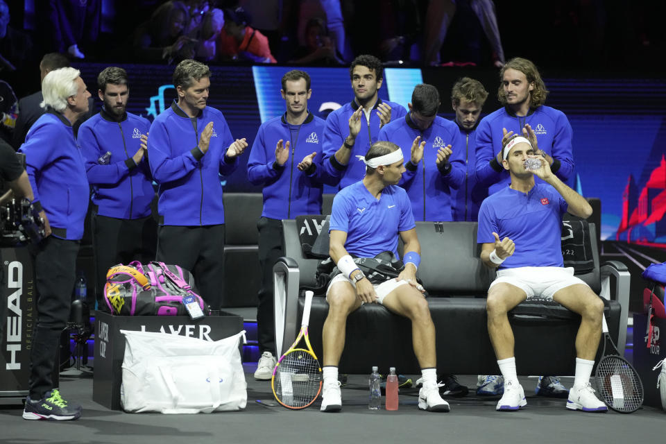 Team Europe's Roger Federer, front right, and Rafael Nadal get ready for their Laver Cup doubles match against Team World's Jack Sock and Frances Tiafoe at the O2 arena in London, Friday, Sept. 23, 2022. (AP Photo/Kin Cheung)