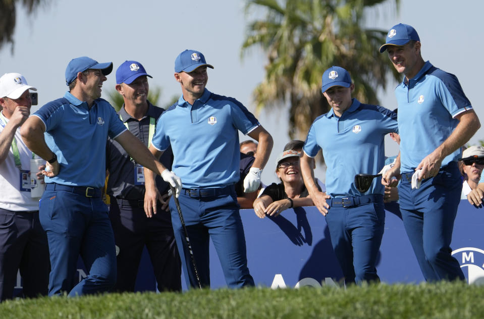 Europe's Rory Mcilroy, left, Europe's Nicolai Hojgaard, Europe's Robert Macintyre and Europe's Justin Rose, right talk to each other on the 10th tee during a practice round ahead of the Ryder Cup at the Marco Simone Golf Club in Guidonia Montecelio, Italy, Wednesday, Sept. 27, 2023. The Ryder Cup starts Sept. 29, at the Marco Simone Golf Club. (AP Photo/Alessandra Tarantino)