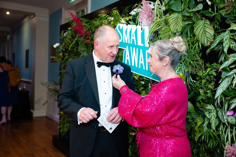 The minister for Small Business and a woman in a pink dress