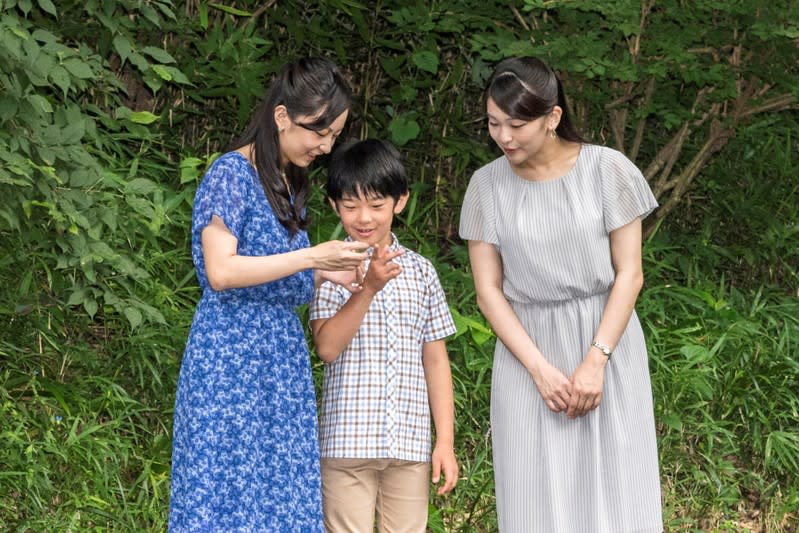 FILE PHOTO: Japan's Prince Hisahito, the only son of Prince Akishino and Princess Kiko, talks with his sisters, Princess Kako and Princess Mako, at the Akasaka imperial residence in Tokyo