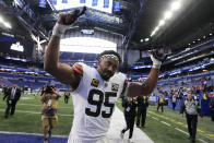 Cleveland Browns defensive end Myles Garrett (95) celebrates as he walks off the field after an NFL football game against the Indianapolis Colts, Sunday, Oct. 22, 2023, in Indianapolis. The Browns won 39-38. (AP Photo/Michael Conroy)