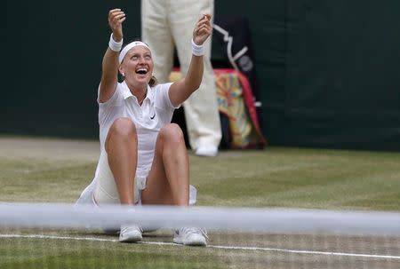 Petra Kvitova of the Czech Republic celebrates after defeating Eugenie Bouchard of Canada in their women's singles final tennis match at the Wimbledon Tennis Championships in London July 5, 2014. REUTERS/Suzanne Plunkett