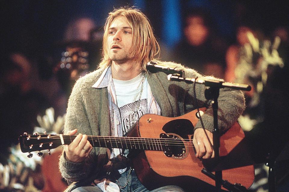 Kurt Cobain playing guitar during Nirvana’s 1993 MTV “Unplugged” performance.