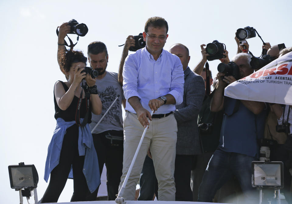 Ekrem Imamoglu, candidate of the secular opposition Republican People's Party, or CHP, releases the line to start a boat ride in the Bosphorus Strait, following his last election rally in Istanbul, Saturday, June 22, 2019, ahead of June 23 re-run of Istanbul elections.The 49-year-old candidate won the March 31 local elections with a slim majority, but Turkey's electoral authority annulled the result of the vote and ordered the new election. (AP Photo/Lefteris Pitarakis)