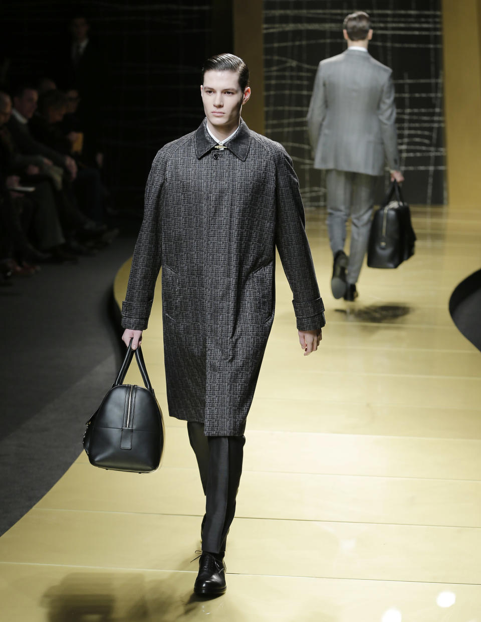 A model wears a creation of Ermenegildo Zegna men's Fall-Winter 2013-14 collection, part of the Milan Fashion Week, unveiled in Milan, Italy, Saturday, Jan. 12, 2013. (AP Photo/Antonio Calanni)