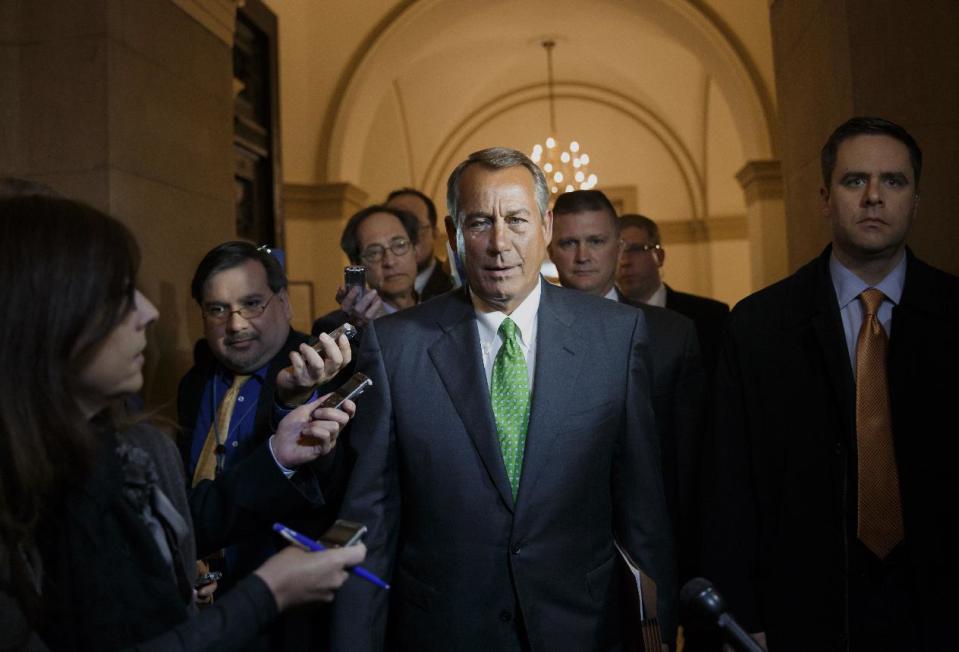 House Speaker John Boehner of Ohio is surrounded by reporters as he returns to the Capitol in Washington, Tuesday, Feb. 25, 2014, following a meeting at the White House with President Barack Obama. (AP Photo/J. Scott Applewhite)