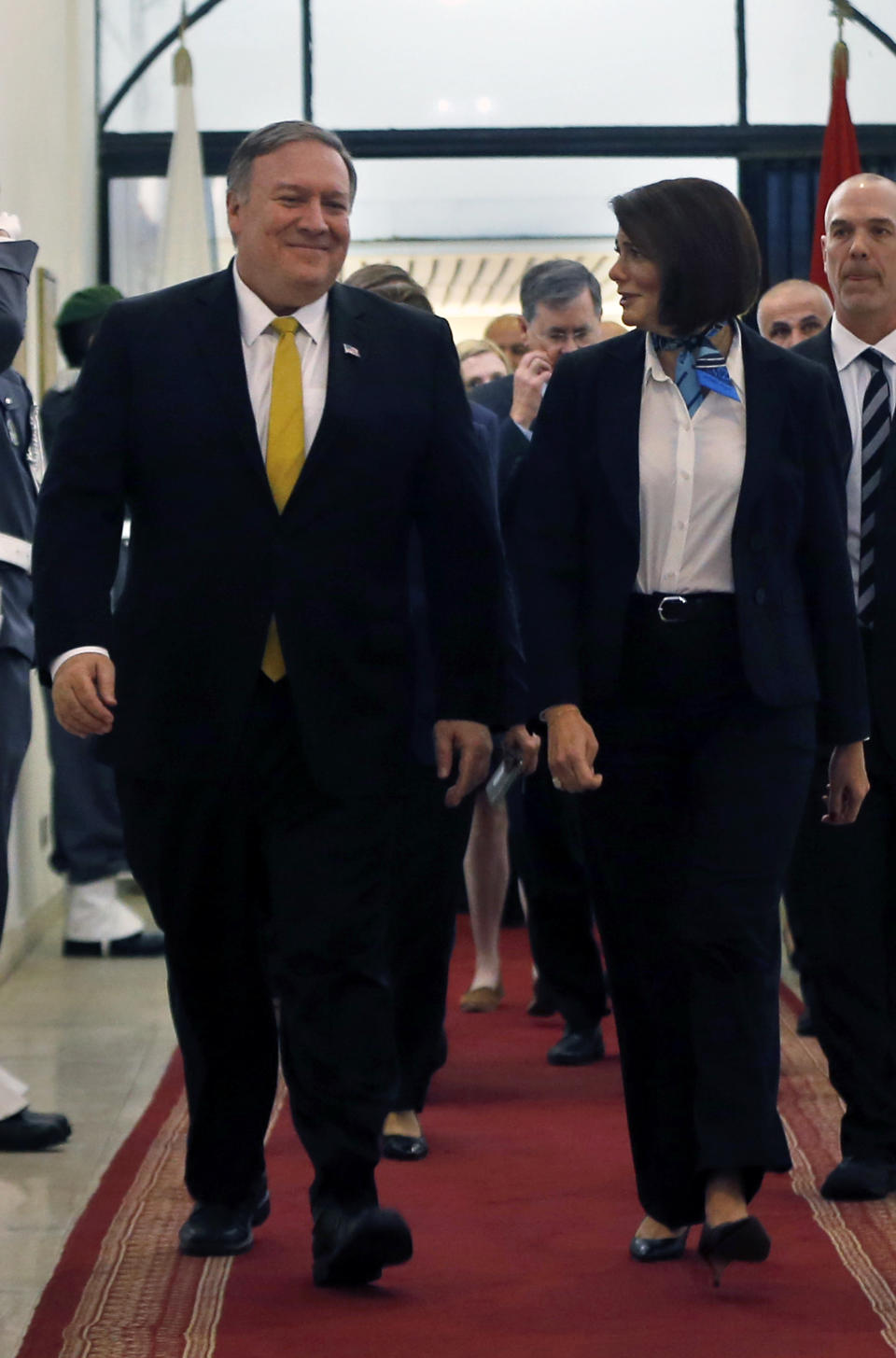 Lebanon's Interior Minister Raya El Hassan, right, walks with U.S. Secretary of State Mike Pompeo, at the interior ministry in Beirut, Lebanon, Friday, March 22, 2019. Pompeo has arrived in Lebanon, the last leg of a Mideast tour that also took him to Kuwait and Israel. (AP Photo/Bilal Hussein)