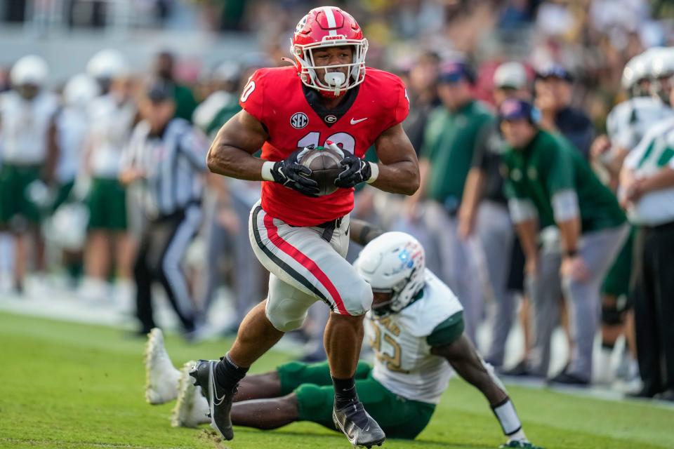 Georgia linebacker Jamon Dumas-Johnson (10) intercepts a pass that he returns for a touchdown against Alabama-Birmingham during the second half at Sanford Stadium.