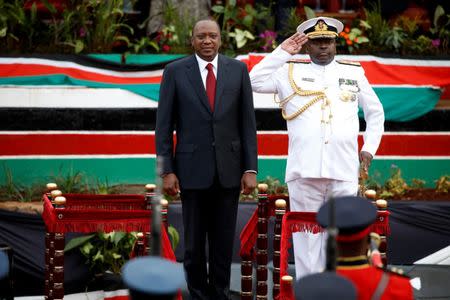 Kenya's President Uhuru Kenyatta stands next to General Samson Mwathethe, Chief of the Kenya Defence Forces (KDF) during the country's Mashujaa Day (Heroes' Day) celebrations at the Uhuru park in Nairobi, Kenya October 20, 2017. REUTERS/Baz Ratner