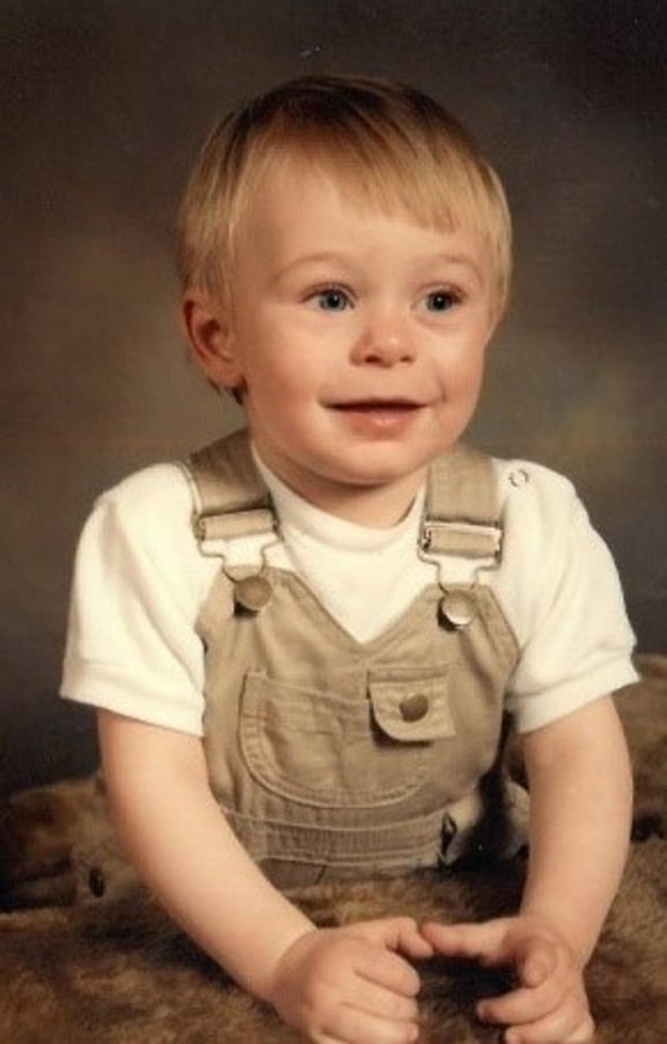 A Home Office postmortem found Mr Hackett (pictured as a child) had died from severe abdominal injuries described as the equivalent of him having been in a car crash (Warwickshire Police)