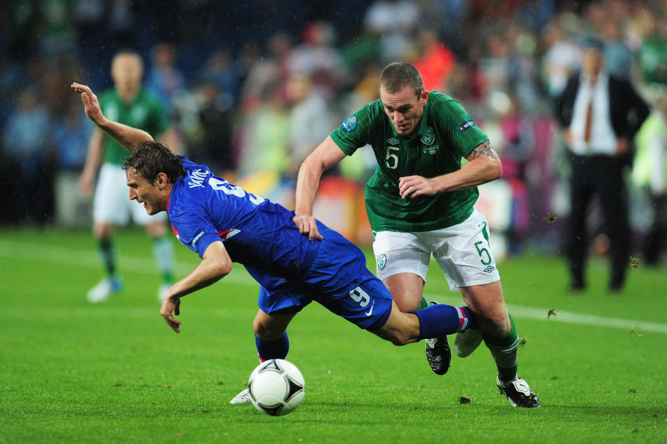 POZNAN, POLAND - JUNE 10: Nikica Jelavic of Croatia clashes with Richard Dunne of Republic of Ireland during the UEFA EURO 2012 group C between Ireland and Croatia at The Municipal Stadium on June 10, 2012 in Poznan, Poland. (Photo by Jamie McDonald/Getty Images)