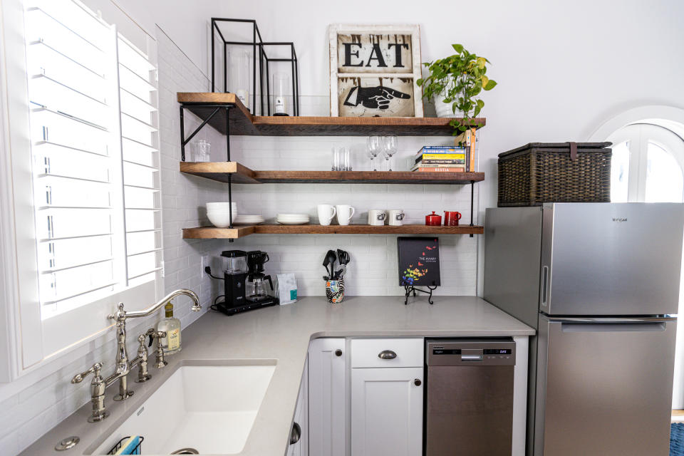 This Town at Trilith tiny house has a sleek, modern kitchen with downsized appliances.
