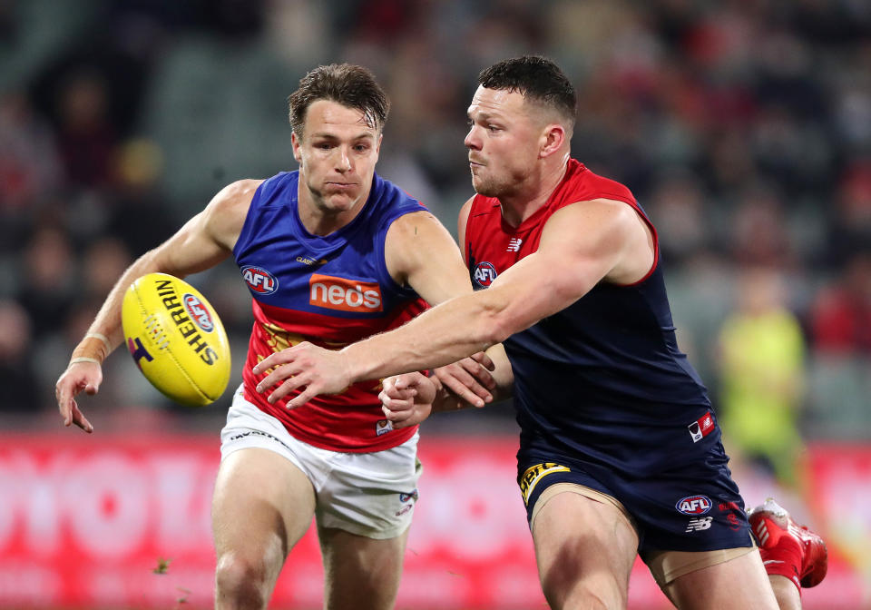 ADELAIDE, AUSTRALIA - AUGUST 28: Lincoln McCarthy of the Lions and Steven May of the Demons during the 2021 AFL First Qualifying Final match between the Melbourne Demons and the Brisbane Lions at Adelaide Oval on August 28, 2021 in Adelaide, Australia. (Photo by Sarah Reed/AFL Photos via Getty Images)