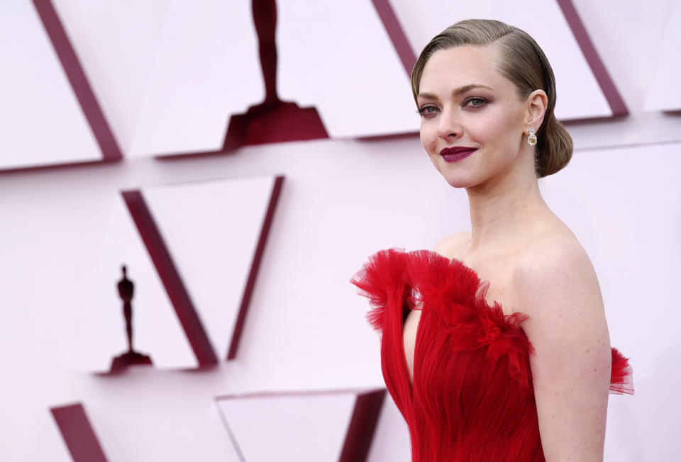 Seyfried at the Oscars in a red dress and an updo