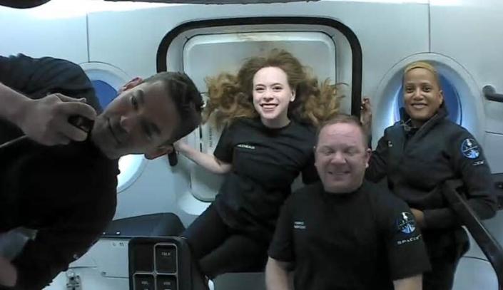 This photo provided by SpaceX shows the passengers of Inspiration4 in the Dragon capsule on their first day in space. They are, from left, Jared Isaacman, Hayley Arceneaux, Chris Sembroski and Sian Proctor. SpaceX got them into a 363-mile (585-kilometer) orbit following Wednesday night’s launch from NASA's Kennedy Space Center. That's 100 miles (160 kilometers) higher than the International Space Station. (SpaceX via AP)