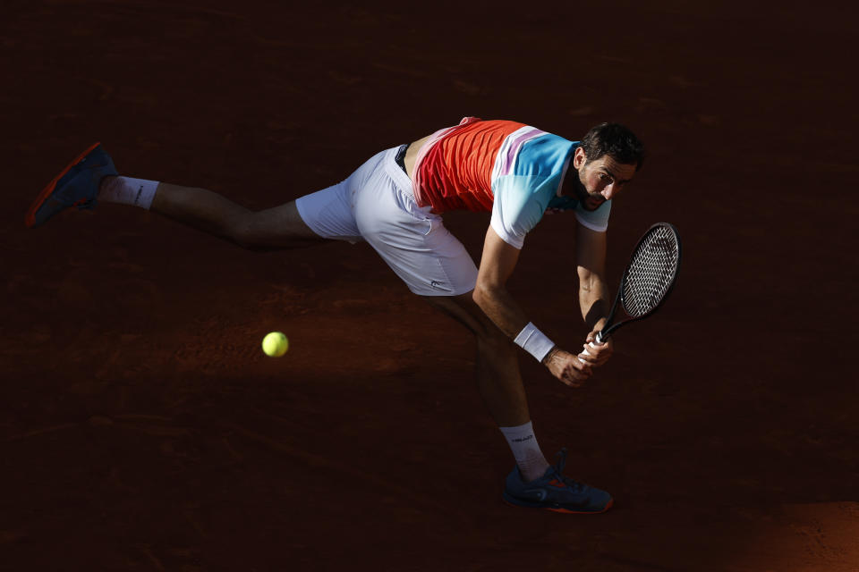 Croatia's Marin Cilic plays a shot against Russia's Andrey Rublev during their quarterfinal match at the French Open tennis tournament in Roland Garros stadium in Paris, France, Wednesday, June 1, 2022. (AP Photo/Jean-Francois Badias)