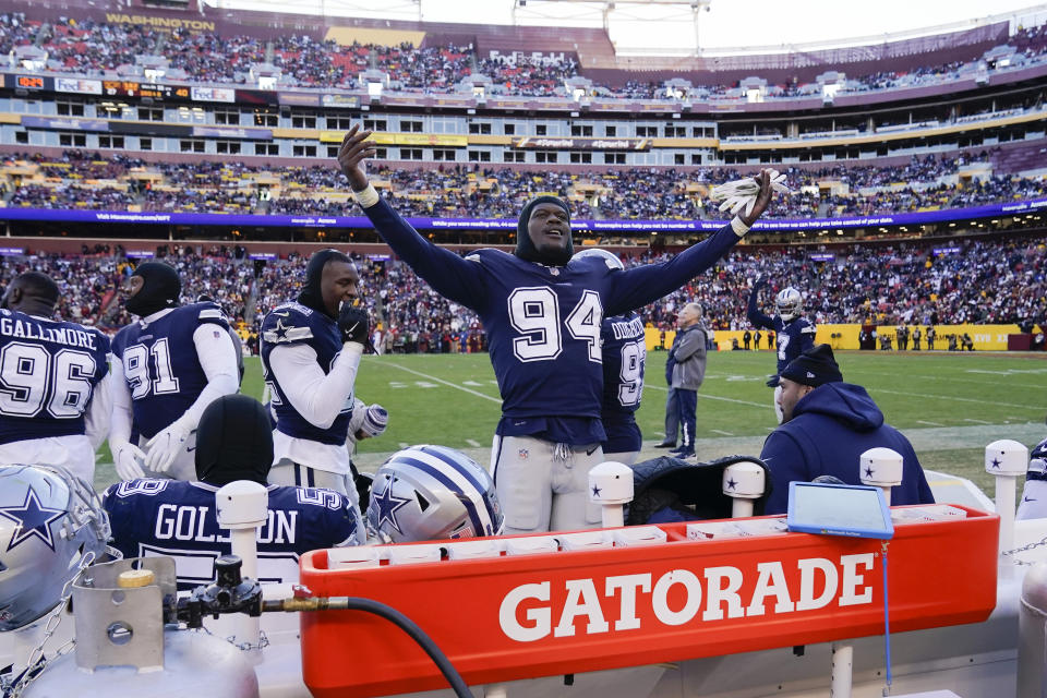 Dallas Cowboys defensive end Randy Gregory (94) gesturing to fans near the end of the second half of an NFL football game, Sunday, Dec. 12, 2021, in Landover, Md. Dallas won 27-20. (AP Photo/Alex Brandon)