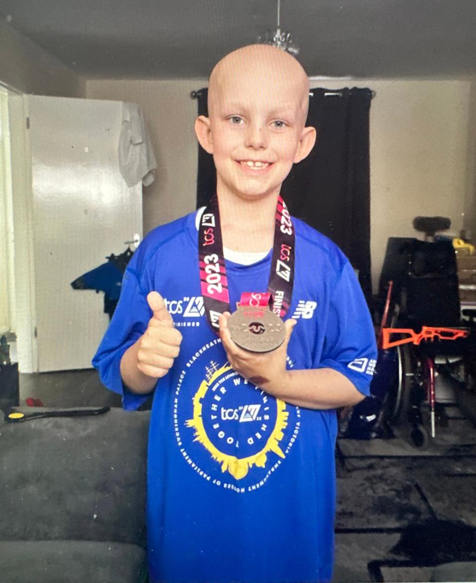 Stanley, seen here at age 8, had been through three rounds of chemotherapy, two brain surgeries and was about to undergo radiation. He received Michelle Maricic's medal and T-shirt from the London Marathon, inspiring the charity, One Medal.