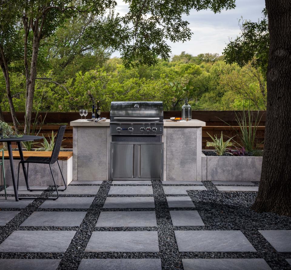 A cool-toned modern outdoor kitchen is all the rage.