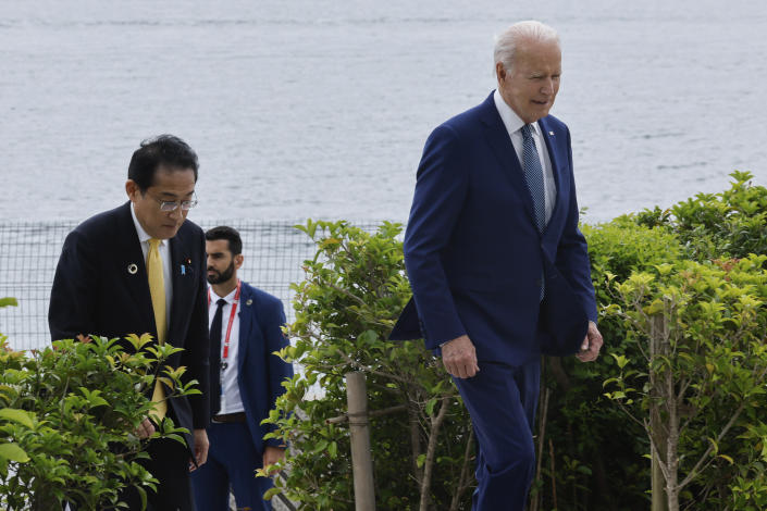 Japan's Prime Minister Fumio Kishida, left, and U.S. President Joe Biden walk ahead of their working lunch meeting on economic security during the G7 summit, at the Grand Prince Hotel in Hiroshima, western Japan Saturday, May 20, 2023. (Jonathan Ernst/Pool Photo via AP)