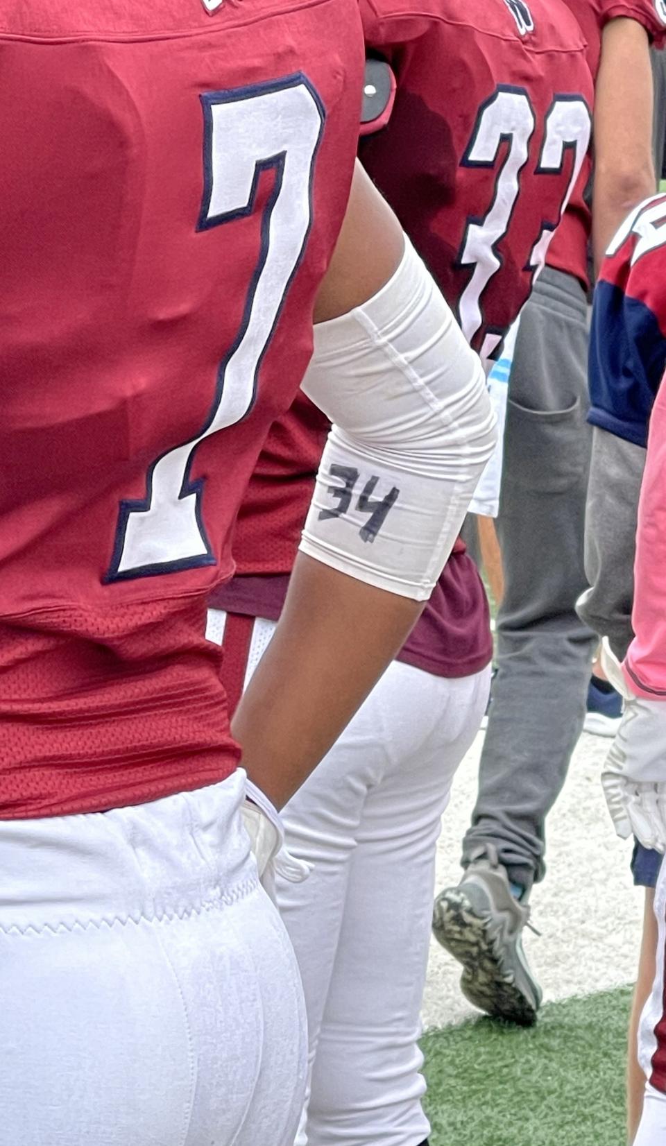 Westborough senior Hemanth Nekkalaudi has teammate Sebastian Grillo's 34 written on one of his arm bands. Grillo is out for the season due to a pre-season foot injury.