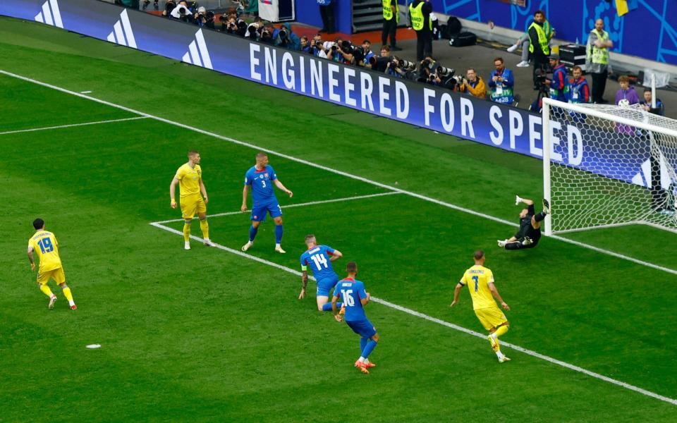 Mykola Shaparenko (No19) equalises for Ukraine.