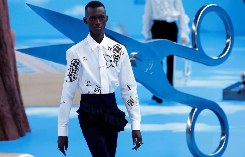 A lasercut shirt with the shapes of the Louis Vuitton monogram.