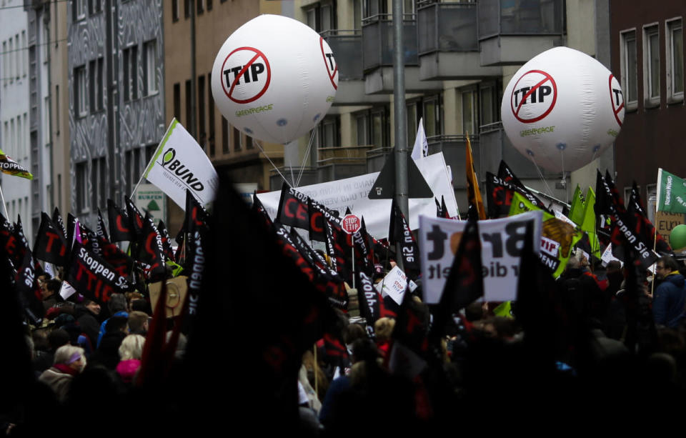 Thousands of demonstrators protest against the planned Transatlantic Trade and Investment Partnership (TTIP) and the Comprehensive Economic and Trade Agreement (CETA) ahead a visit by President Obama in Hanover, Germany, April 23, 2016. (Markus Schreiber/AP) 