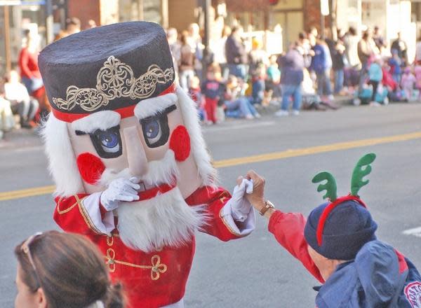 A holiday nutcracker interacts with the crowd during the Quincy Christmas Parade in this undated file photo.