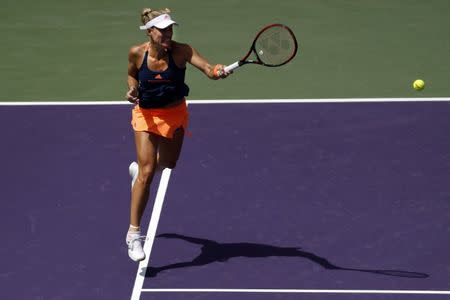 Mar 26, 2017; Miami, FL, USA; Angelique Kerber of Germany hits a forehand against Shelby Rogers of the United States (not pictured) on day six of the 2017 Miami Open at Crandon Park Tennis Center. Kerber won 6-4, 7-5. Mandatory Credit: Geoff Burke-USA TODAY Sports