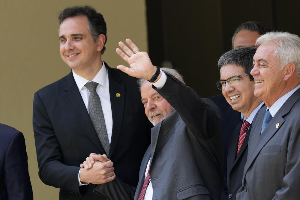 FILE - Brazilian President-elect Luiz Inacio Lula da Silva waves next to Senate President Rodrigo Pacheco, left, after a meeting in Brasilia, Brazil, Wednesday, Nov. 9, 2022. Brazilian lawmakers on Wednesday, Feb. 1, 2023, voted to reelect Lower House's Speaker Arthur Lira and Senate President Pacheco, bolstering President Lula's prospects for passing legislation and governability in the polarized nation. (AP Photo/Eraldo Peres, File)