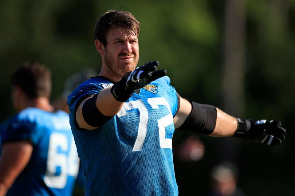 Jaguars offensive lineman Walker Little (72) stretches during training camp.