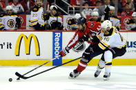 WASHINGTON, DC - APRIL 22: Roman Hamrlik #44 of the Washington Capitals and David Krejci #46 of the Boston Bruins battle for the puck in Game Six of the Eastern Conference Quarterfinals during the 2012 NHL Stanley Cup Playoffs at Verizon Center on April 22, 2012 in Washington, DC. (Photo by Patrick McDermott/Getty Images)