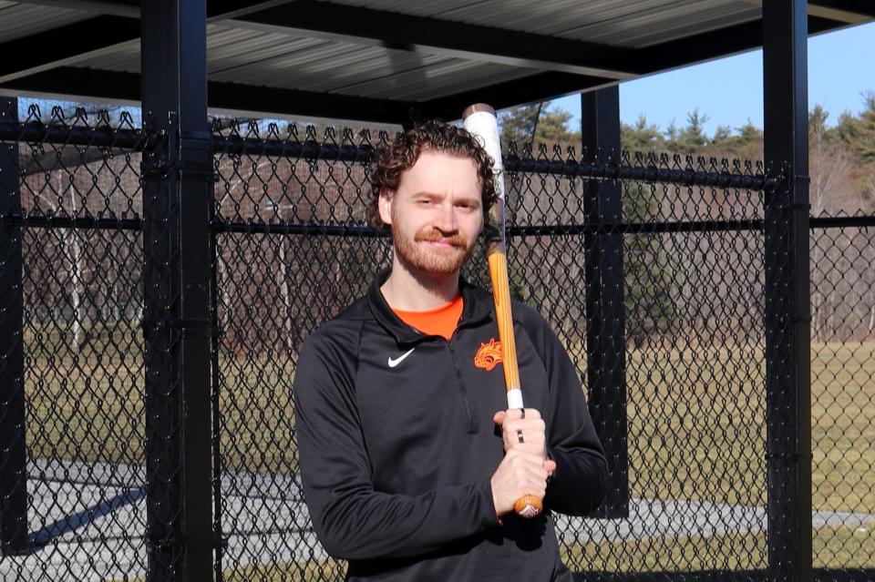 Head varsity baseball coach Tony Sylvester stands in front of the new dugouts at Gardner High baseball field. Sylvester takes over the varsity program for its first appearance since the 2021 season.