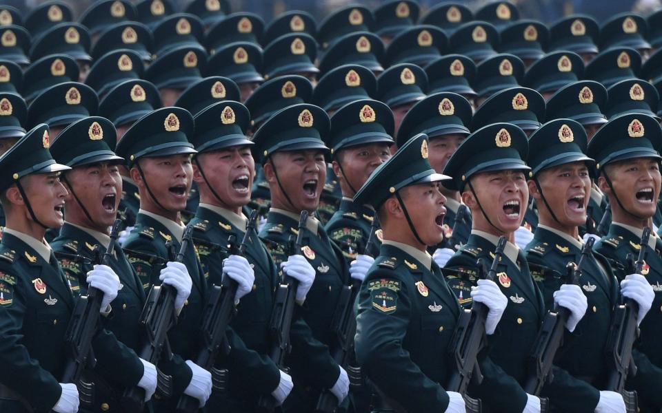 Chinese troops march during a military parade in Tiananmen Square in Beijing. US military officials have warned that China could invade Taiwan by 2027