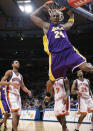 FILE - In this Feb. 2, 2009 file photo Los Angeles Lakers guard Kobe Bryant (24) reacts after a slam dunk shot in the first half of an NBA basketball game at Madison Square Garden in New York. Bryant had 61 points in the game. Bryant, the 18-time NBA All-Star who won five championships and became one of the greatest basketball players of his generation during a 20-year career with the Los Angeles Lakers, died in a helicopter crash Sunday, Jan. 26, 2020. (AP Photo/Kathy Willens)