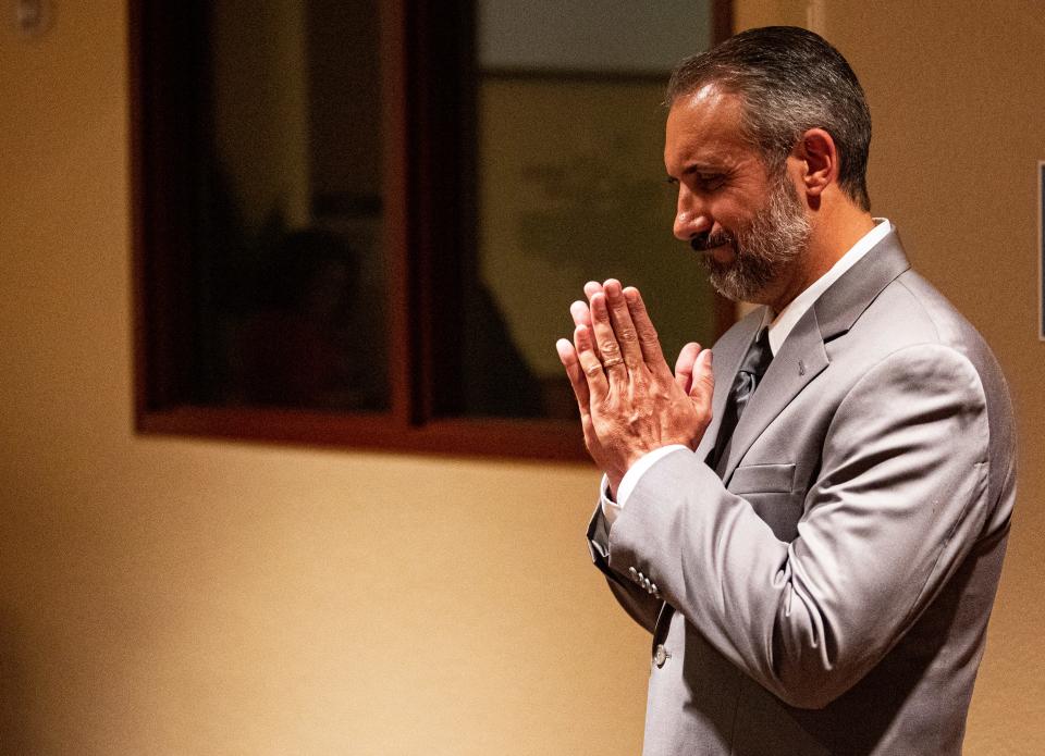 Kenneth Savage acknowledges members of the school board before being sworn in as superintendent of Lee County Schools on Tuesday, April 9, 2024. In November, the voters will decide the superintendent in the general election.