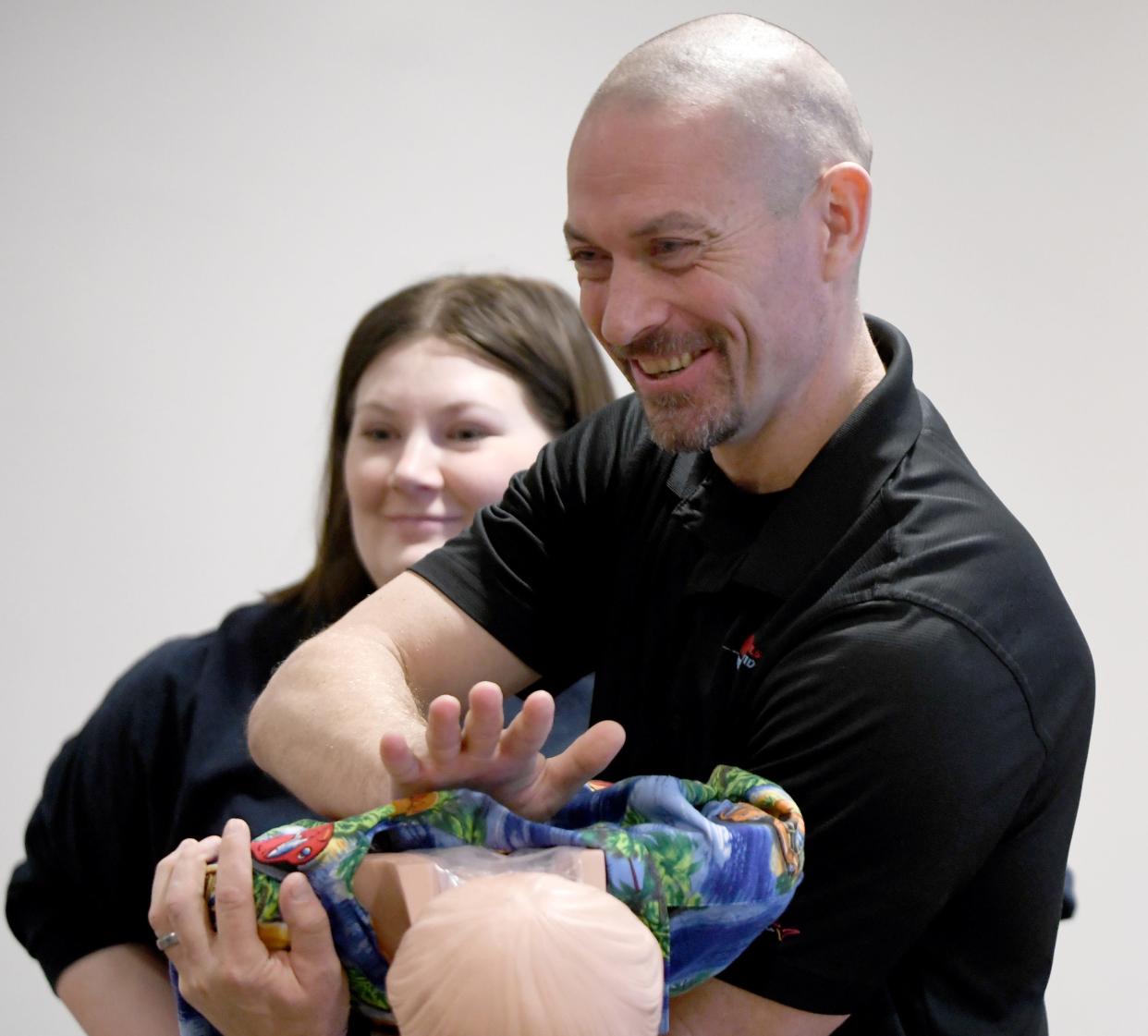 Randy Feesler, owner of The Pulse Provider, instructs a class at the American Red Cross office in Canton. He teaches how to save lives through CPR and other techniques.