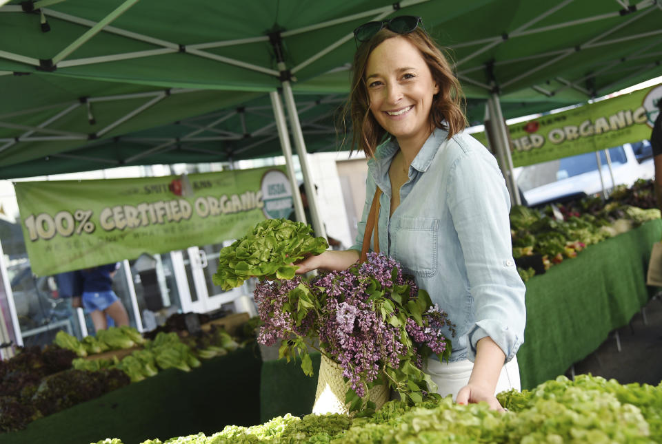 This April 10, 2019 photo shows Gaby Dalkin at Santa Monica Downtown Farmers Market in Santa Monica, Calif. Dalkin, the chef behind the popular Website and social media accounts, What’s Gaby Cooking, is forging her own path. Every Monday she posts a live demo to Instagram as she cooks dinner which has become appointment viewing for some fans. Her husband films it and reads questions from viewers as she’s cooking. (AP Photo/Chris Pizzello)