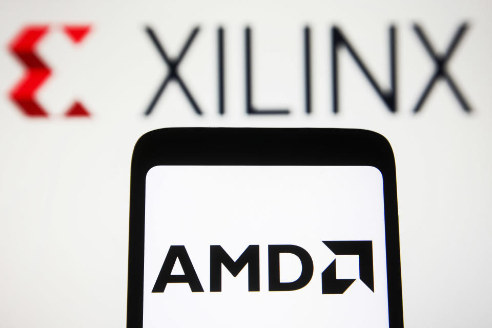 UKRAINE - 2022/01/28: In this photo illustration, an AMD (Advanced Micro Devices Inc.) logo is displayed on a smartphone screen with the Xilinx Inc logo in the background. (Photo Illustration by Pavlo Gonchar/SOPA Images/LightRocket via Getty Images)