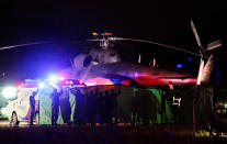 <p>Rescued schoolboys are moved from a military helicopter to an awaiting ambulance at a military airport in Chiang Rai, Thailand, on July 9, 2018. (Photo: Athit Perawongmetha/Reuters) </p>