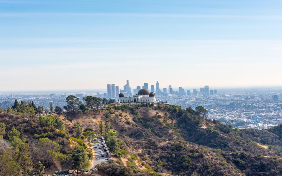 Griffith Park Observatory Downtown buildings Los Angeles - Getty