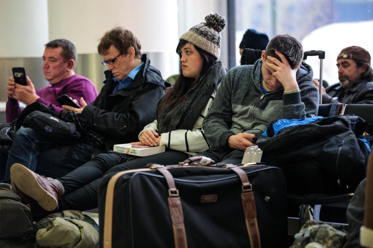 Passengers wait in the South Terminal building at London Gatwick Airport after flights resumed Dec. 21, 2018. Flights were halted again after that amid another suspected drone sighting.