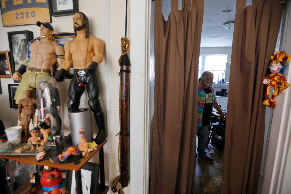 Joe Quigley walks across his kitchen as he and fellow tenants of the 189-193 Elm Street apartment complex have been told to vacate by November 1.