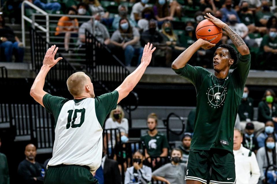 Michigan State's Marcus Bingham Jr. shoots as Joey Hauser defends during open practice on Saturday, Oct. 2, 2021, at the Breslin Center in East Lansing.